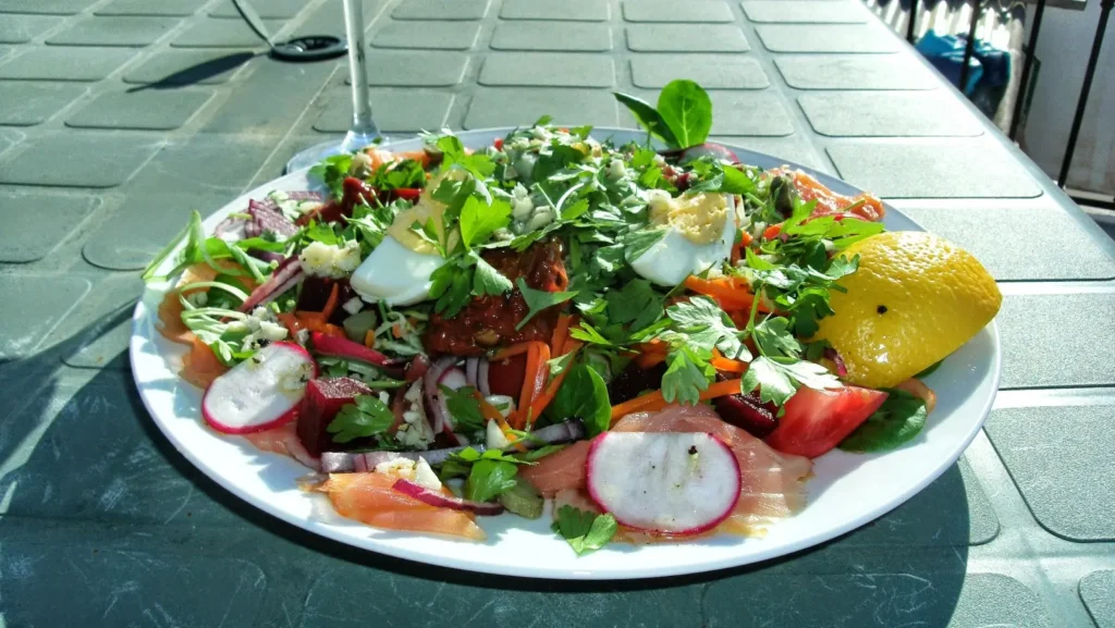 Smoked salmon salad with beetroot, herbs, hard-boiled egg and lemon on the Casa Adora roof terrace