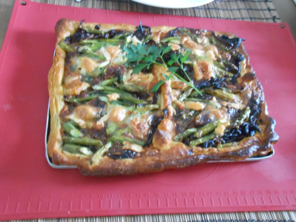 Caramelised onion, asparagus and goat's cheese tart on a baking sheet, Casa Adora
