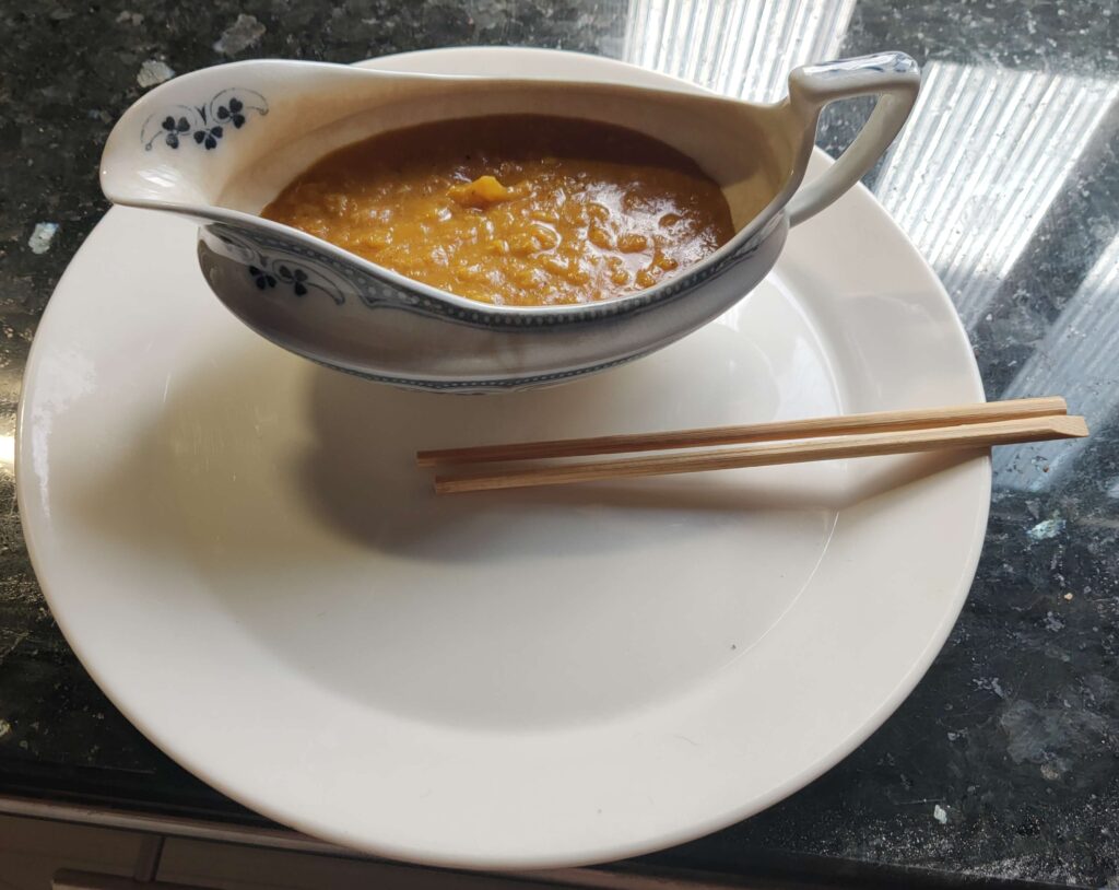 Homemade katsu curry sauce served in an antique Edwardian gravy boat with chopsticks
