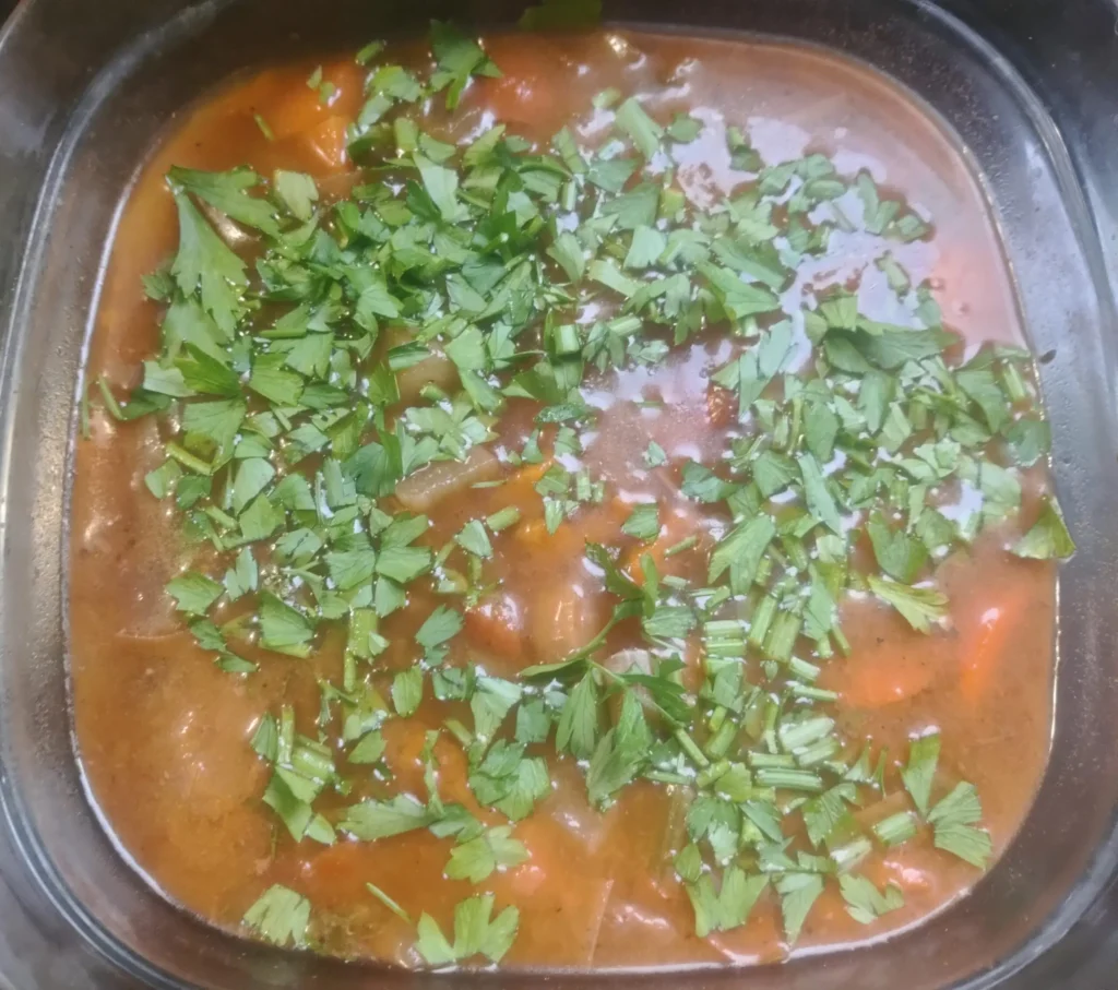 Slow cooker beef stew with parsley, ready for the mash topping โ slow cooker beef stew cottage pie โ The Flexible Chef