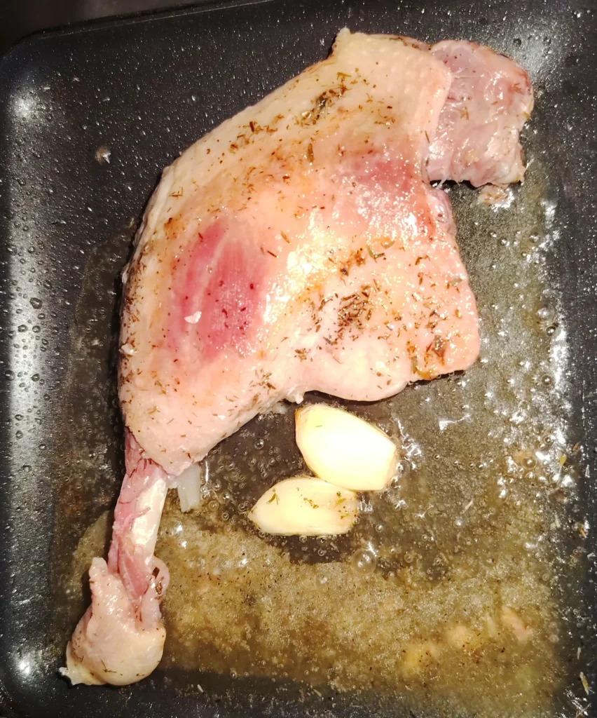 Confit de Canard cooking in the RidgeMonkey with garlic and thyme — campervan recipe