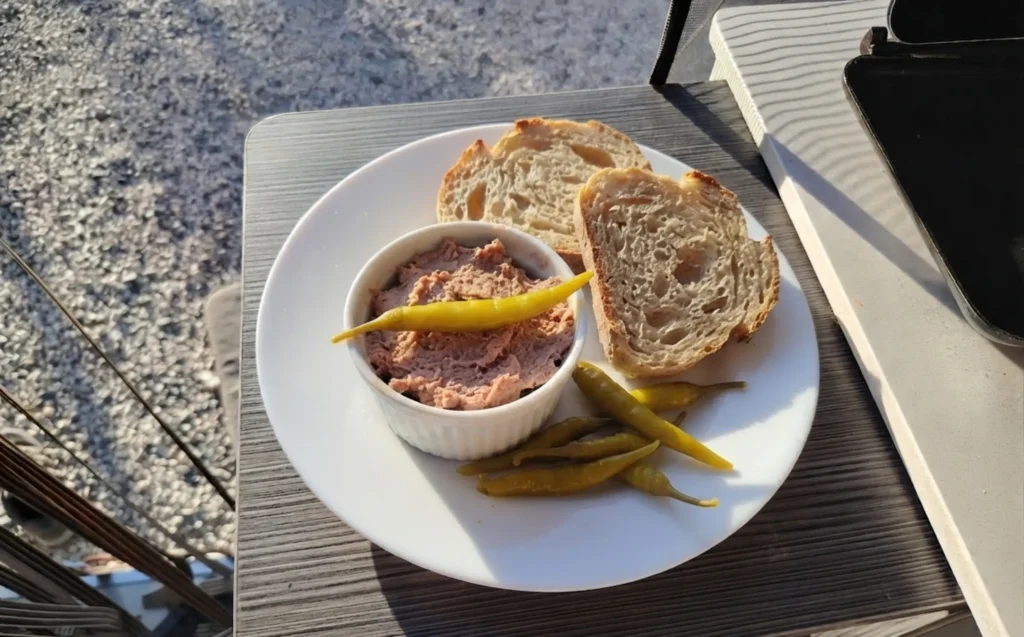 Bonito pâté recipe with pickled guindilla peppers and crusty bread on a van table — The Flexible Chef