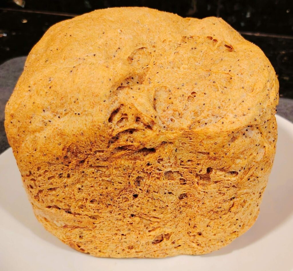Rustic house loaf with Poppy seeds resting on the worktop at Casa Adora