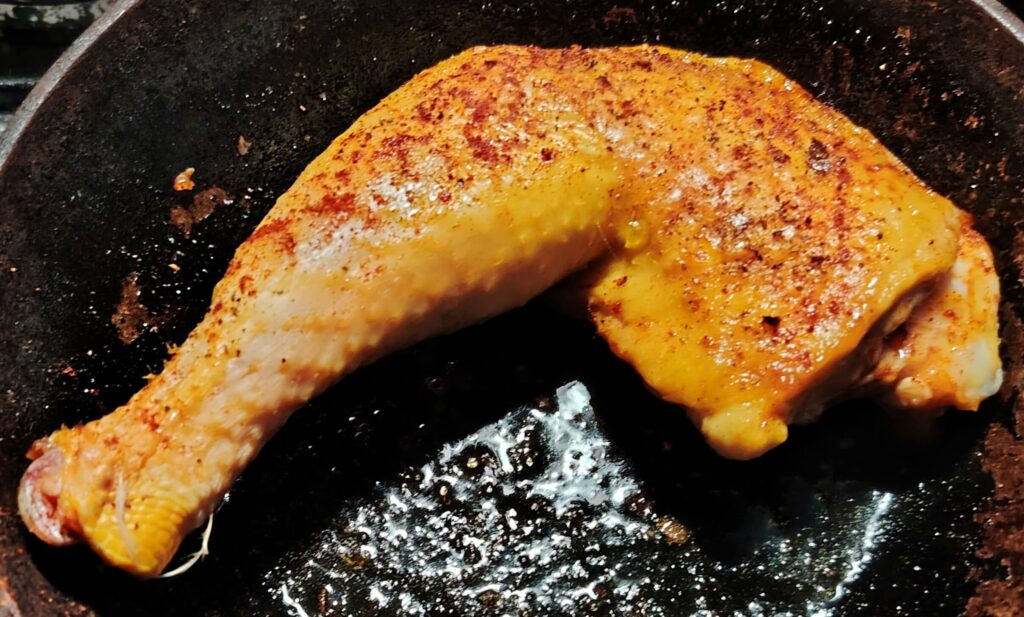 Chicken leg in an oven proof pan.