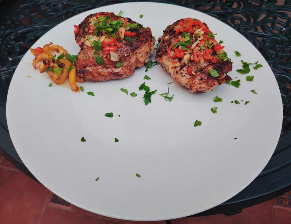 Spanish pil-pil chicken thighs in a cast iron skillet — The Flexible Chef