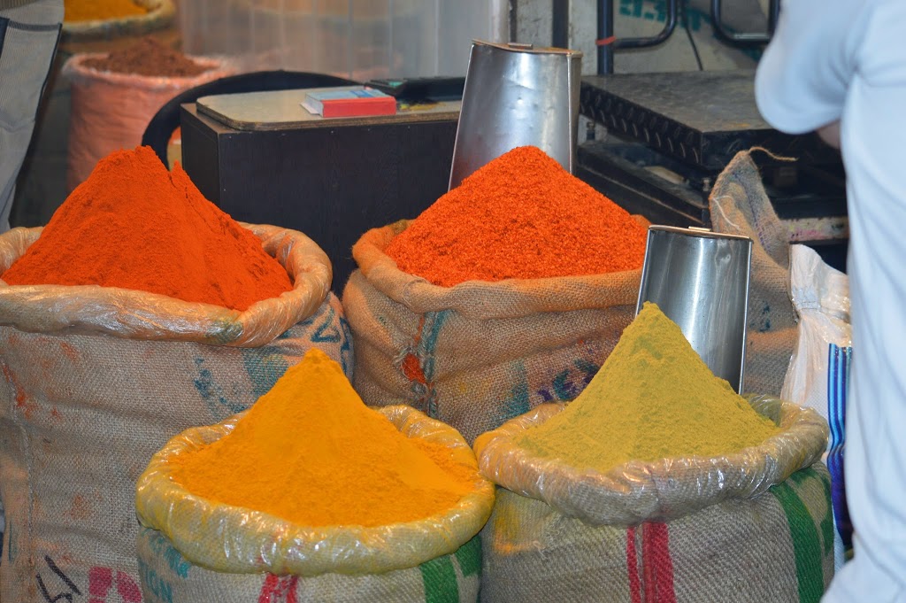 Sacks of ground spices including turmeric, chilli powder and coriander at Chandni Chowk spice market, Delhi, India.