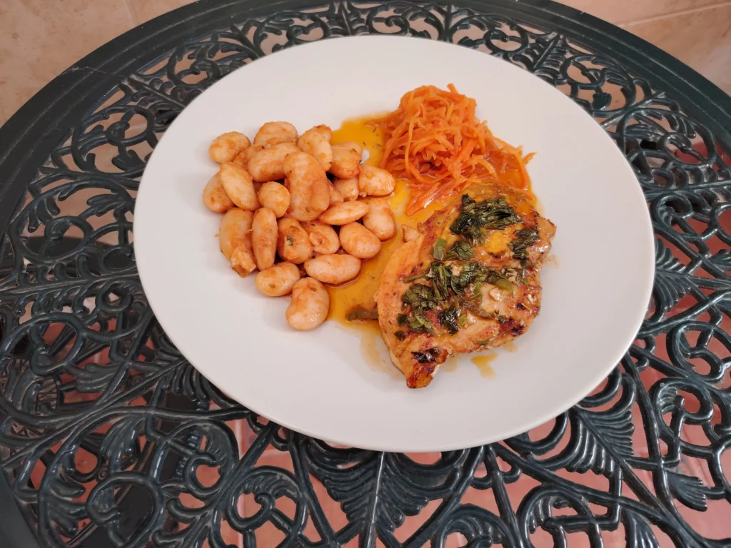 Pan-seared herb chicken with paprika butter beans and Bionsan fermented carrot served straight from the jar