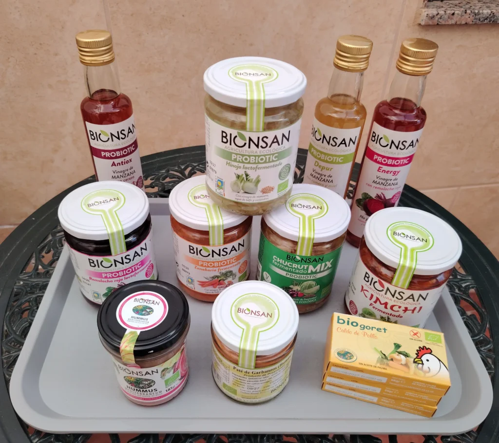 Bionsan fermented foods review haul – probiotic vinegars, fermented vegetables, hummus and stock cubes on a tray at Casa Adora