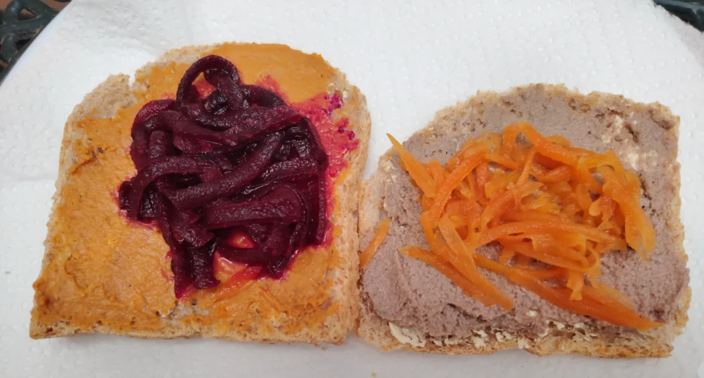 Scandinavian-style open sandwiches with Bionsan beetroot and chickpea hummus topped with fermented carrot and fermented beetroot