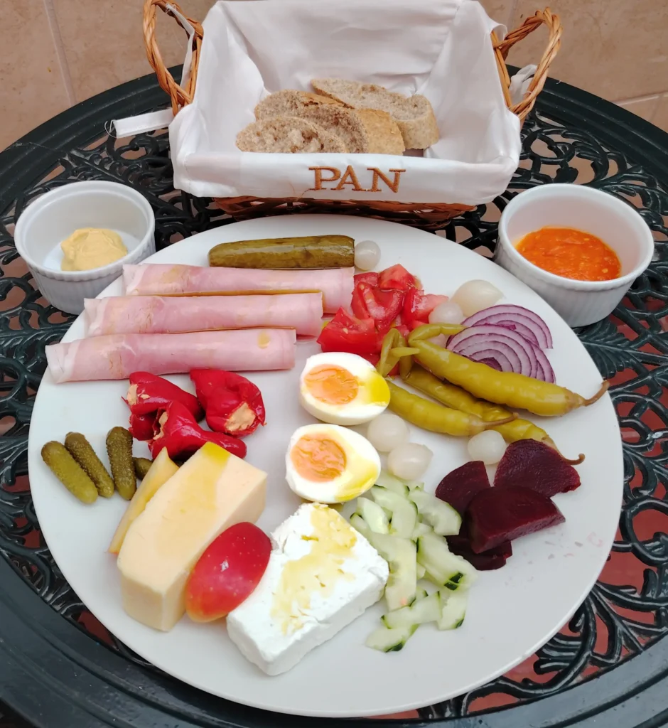 Spanish Ploughman's with cheddar, feta, jamón cocido, fermented pepinos and Mango Ember hot sauce
