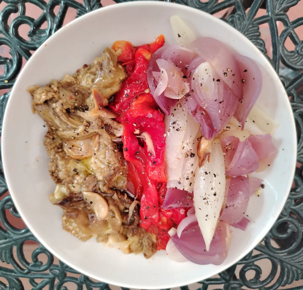 Escalivada recipe – roasted red pepper, aubergine and onion torn into strips on a plate – The Flexible Chef