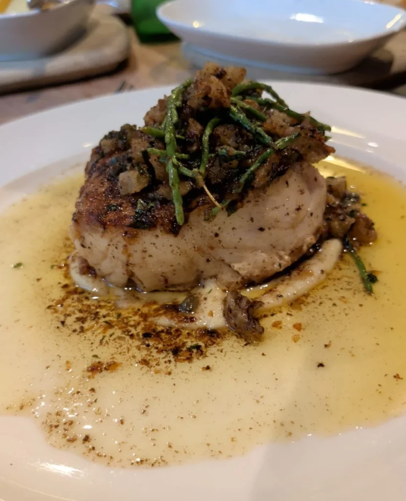 Danny's Cornish hake with potatoes, capers and samphire on a white plate — Cornish hake recipe — The Flexible Chef
