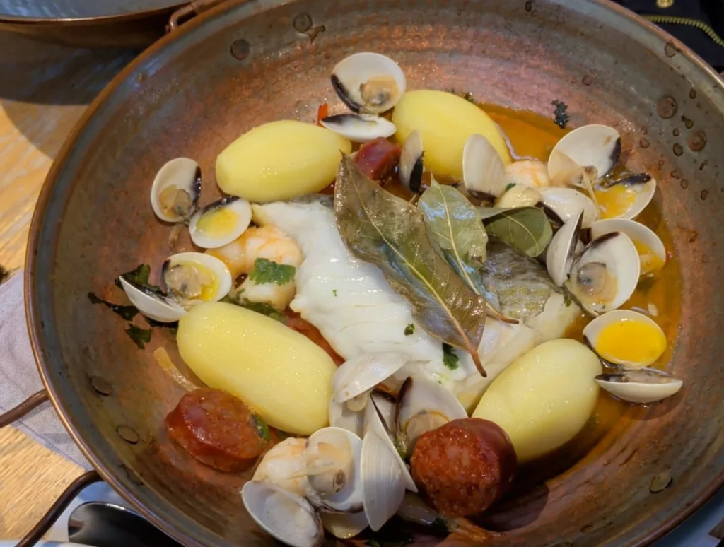 Danny's cataplana — cod, clams, prawns, potatoes and cooking chorizo in a copper cataplana pan — cataplana recipe — The Flexible Chef