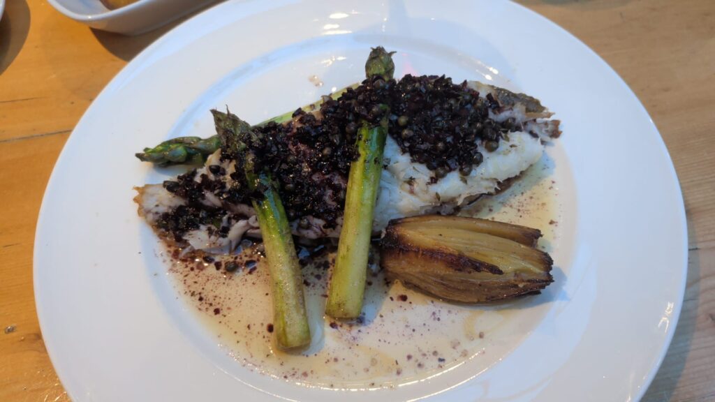 Danny's roasted cod with beluga lentils, asparagus and braised endive on a white plate — roasted cod recipe — The Flexible Chef